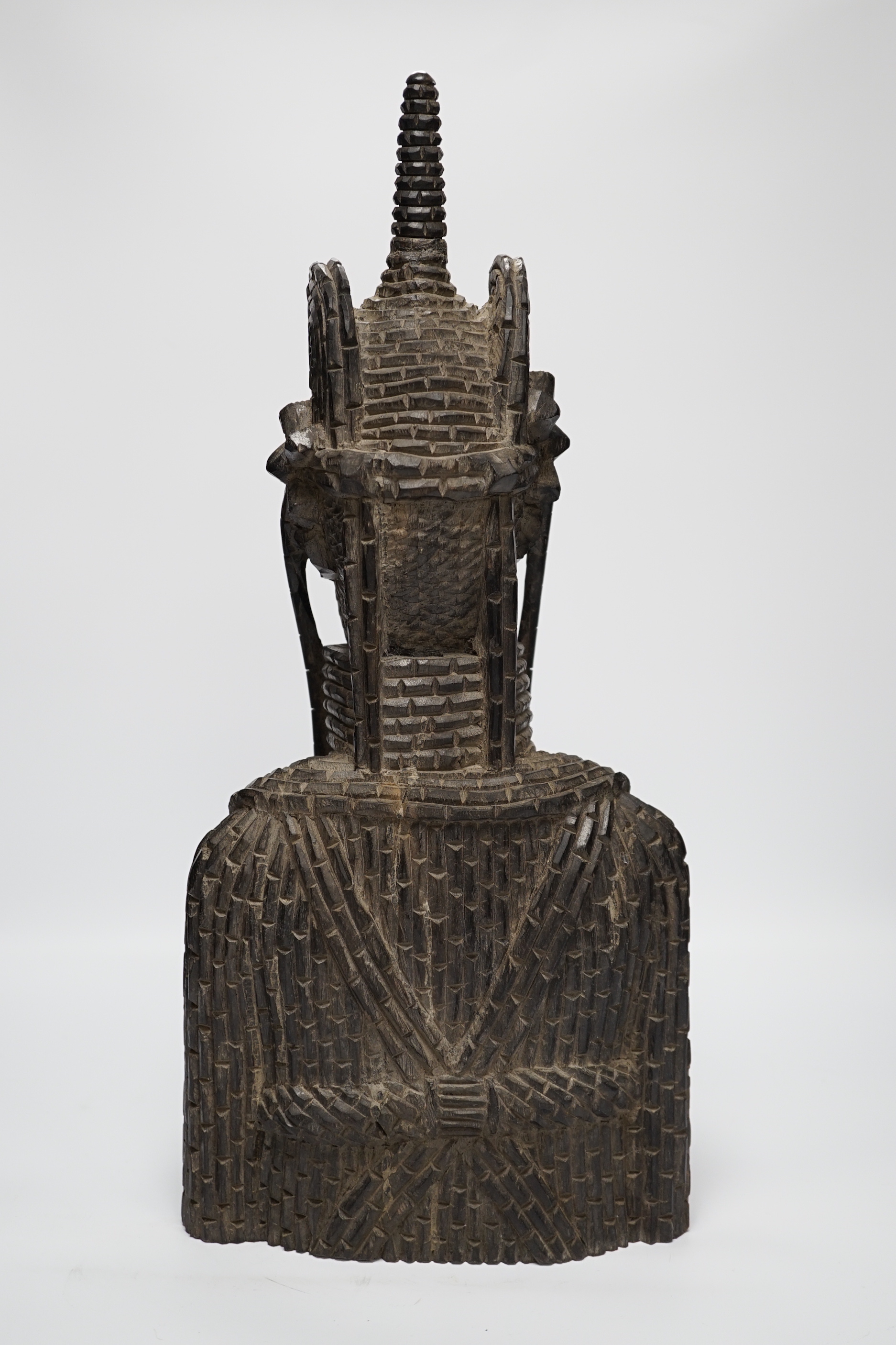 A heavy African ebony carved bust of a warrior, in Benin style, 48cm high